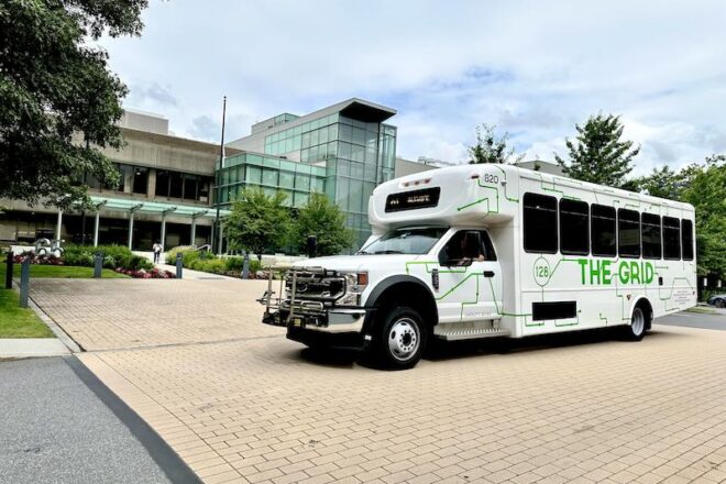 Grid vehicle at 55 Hayden Avenue, illustrating service to member campuses.”