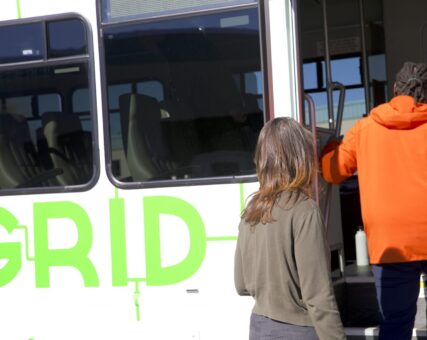 Passengers boarding a Grid vehicle
