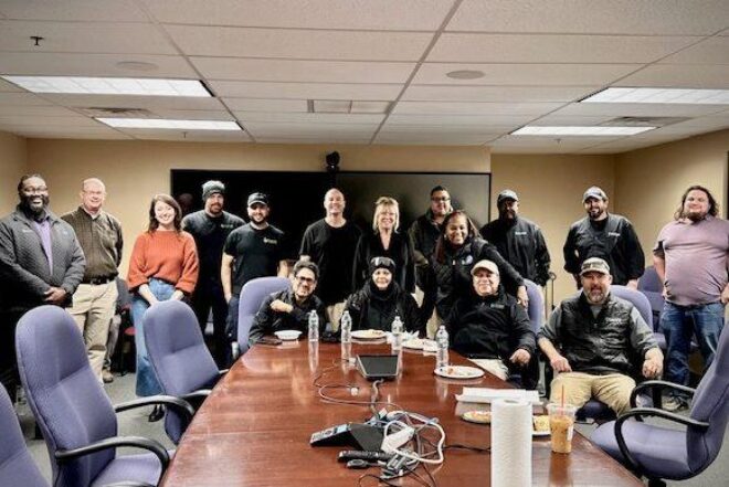 128BC staff, drivers, and TCS partners gathered around a conference table at the Driver Appreciation Luncheon, highlighting 128 Business Council’s gratitude for and strong relationship with its shuttle team.