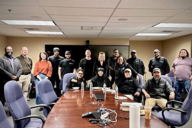 128BC staff, drivers, and TCS partners gathered around a conference table at the Driver Appreciation Luncheon, highlighting 128 Business Council’s gratitude for and strong relationship with its shuttle team.