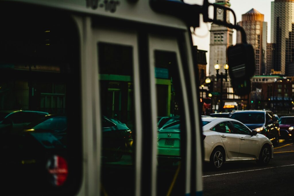 Traffic in the Greater Boston Area, shown against a reflection on a transit bus