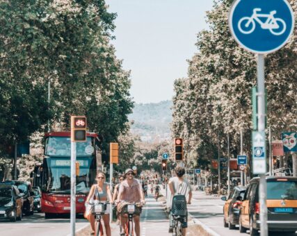 Cyclists and a bus in an urban setting