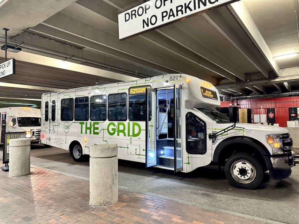 Photo of a Grid bus inside the Alewife Station pickup area.